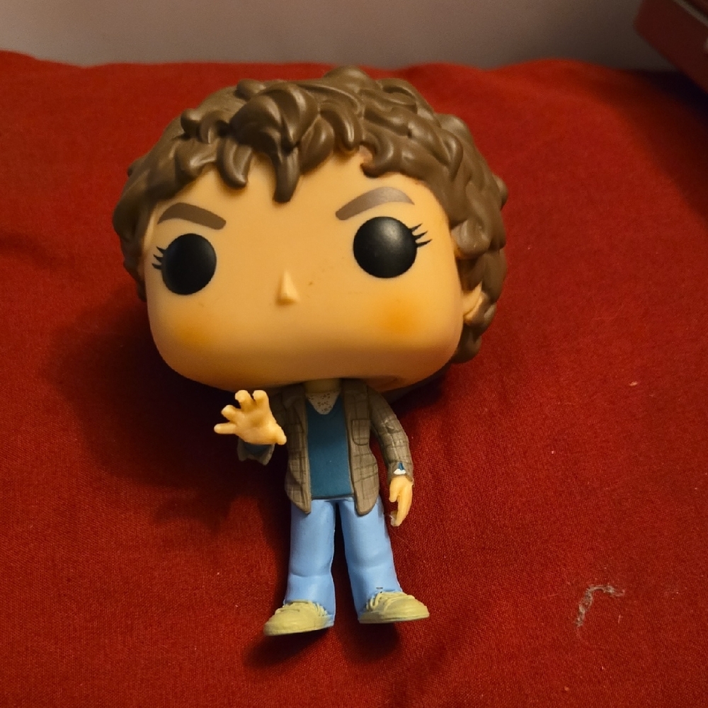 Funko Pop Figure with Brown Hair and Blue Shirt